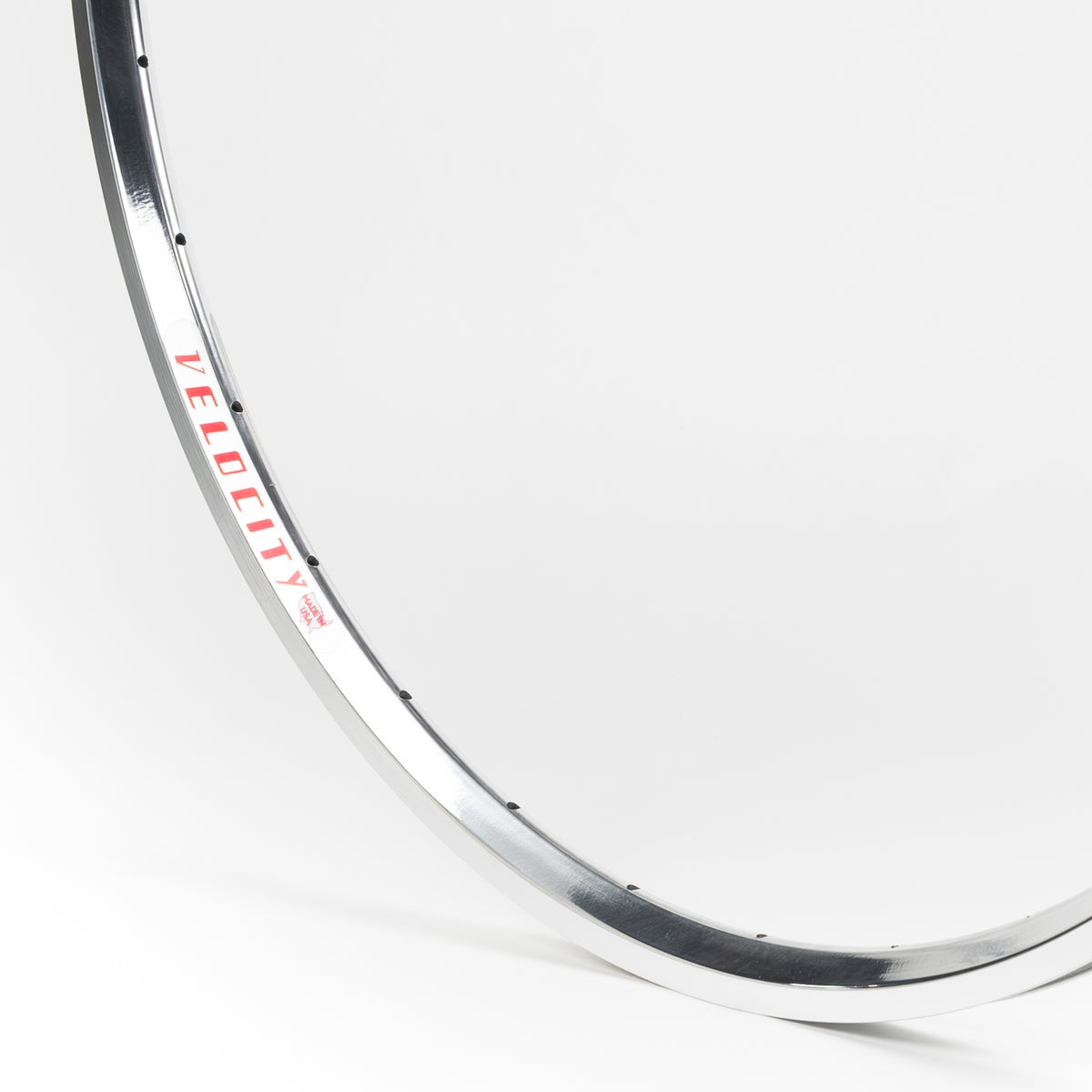 Velocity USA A23 Polished Machined Sidewall bicycle rim, close-up shot on a white background