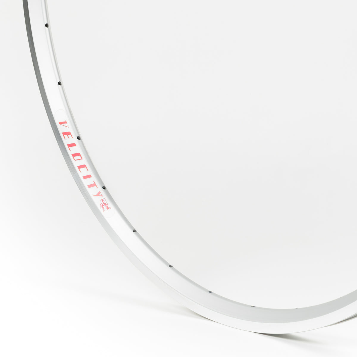 Velocity USA A23 Silver Machined Sidewall bicycle rim, close-up shot on a white background