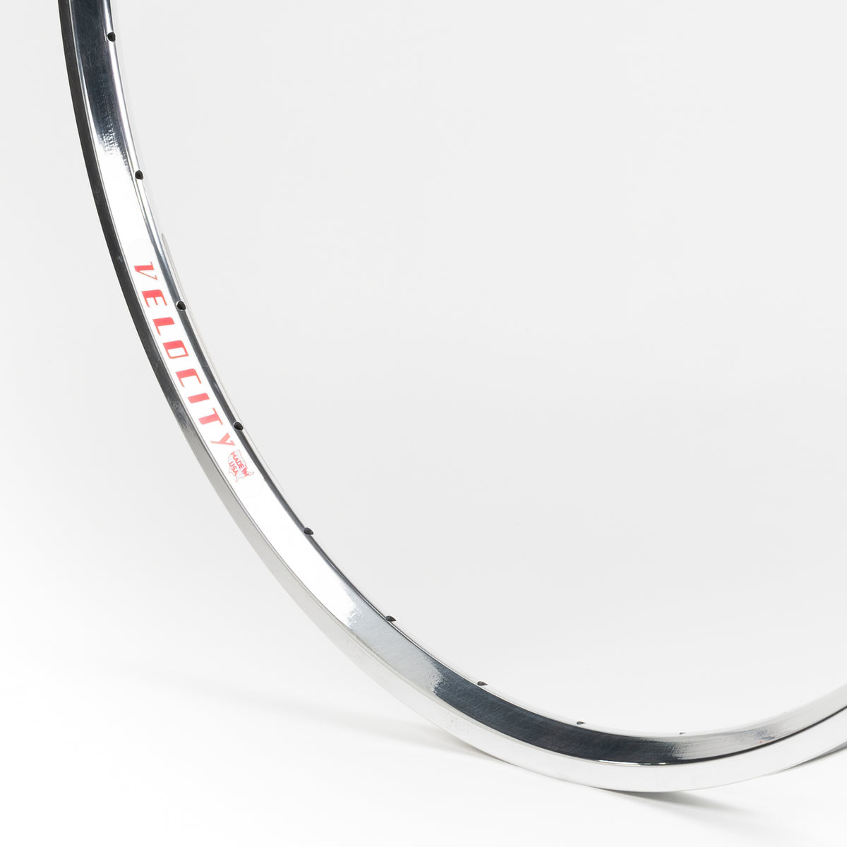 Velocity USA A23 Polished bicycle rim, close-up shot on a white background