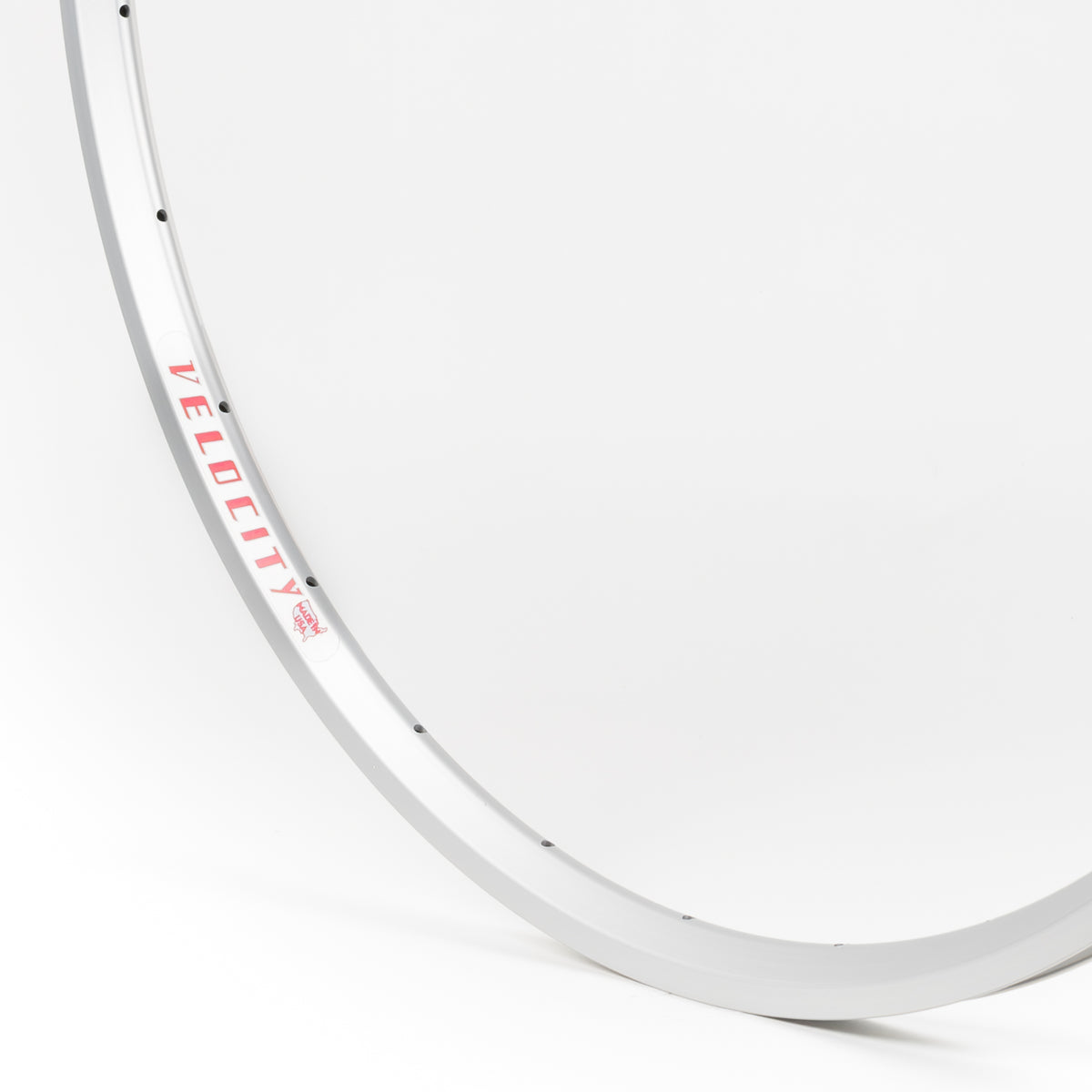 Velocity USA A23 Silver bicycle rim, close-up shot on a white background