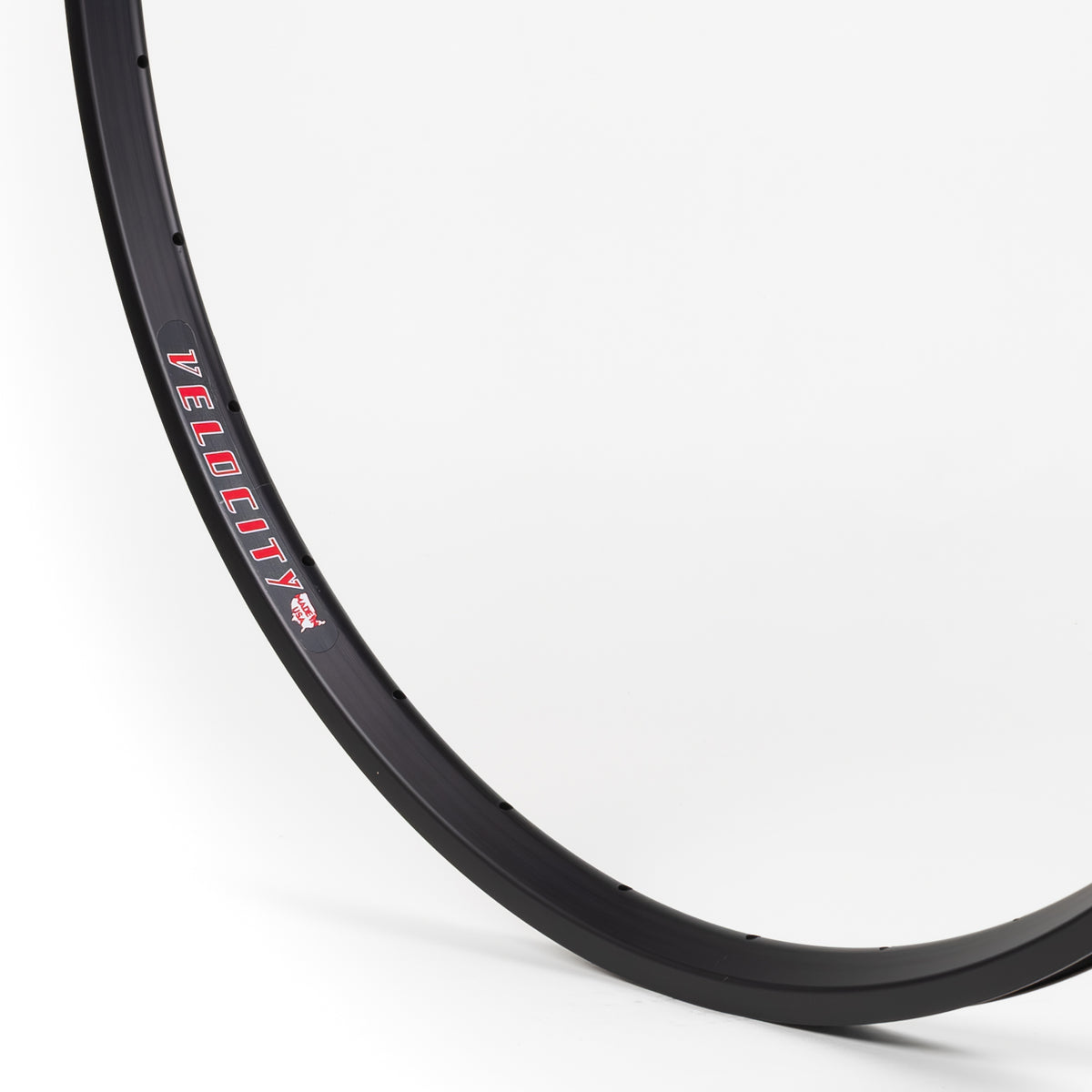 Velocity USA A23 OC Black bicycle rim, close-up shot on a white background