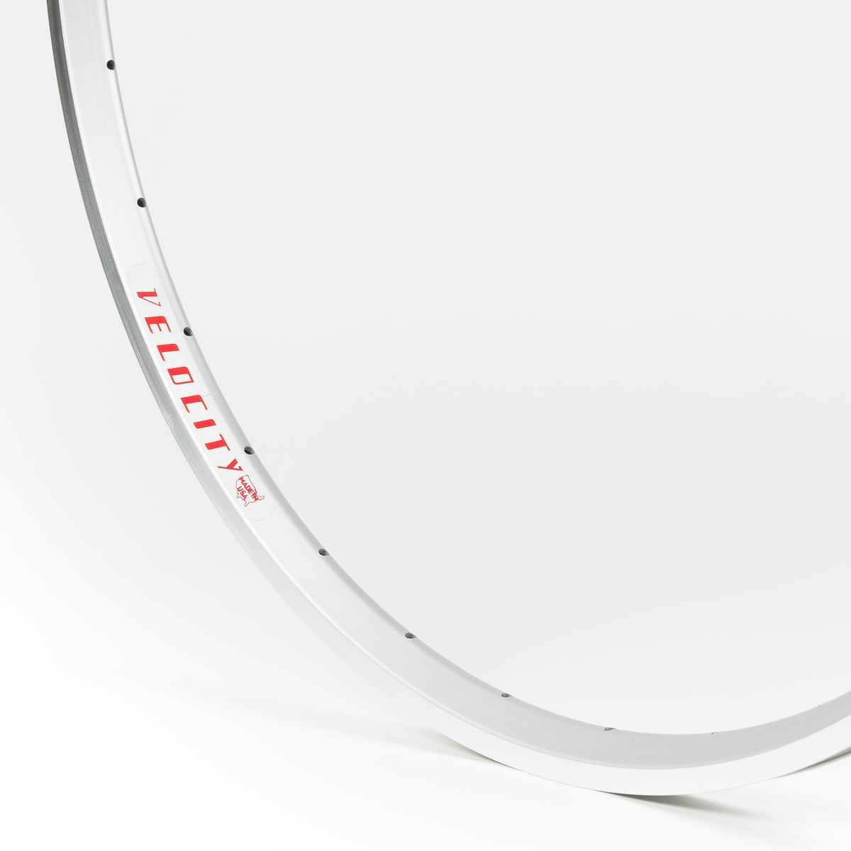 Velocity USA A23 OC Silver Machined Sidewall bicycle rim, close-up shot on a white background