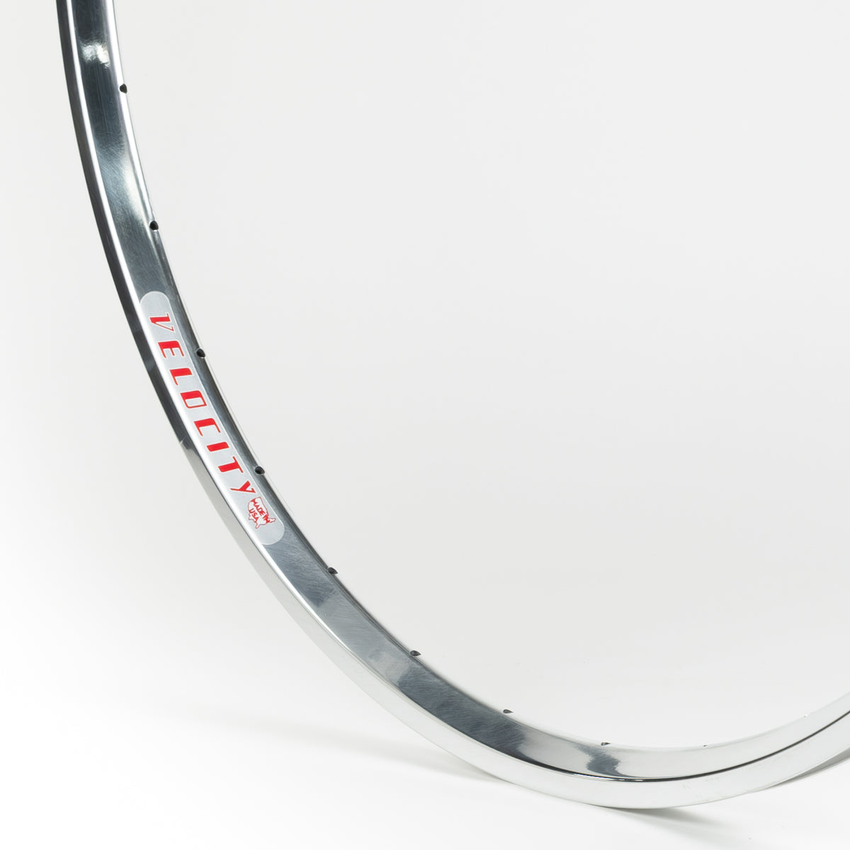 Velocity USA A23 OC Polished bicycle rim, close-up shot on a white background