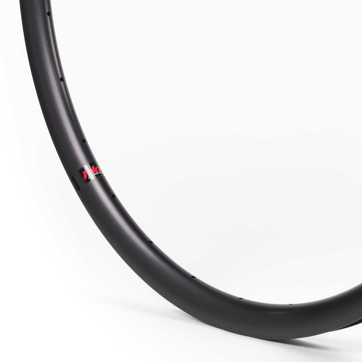 Velocity USA Aero Black bicycle rim, close-up shot on a white background