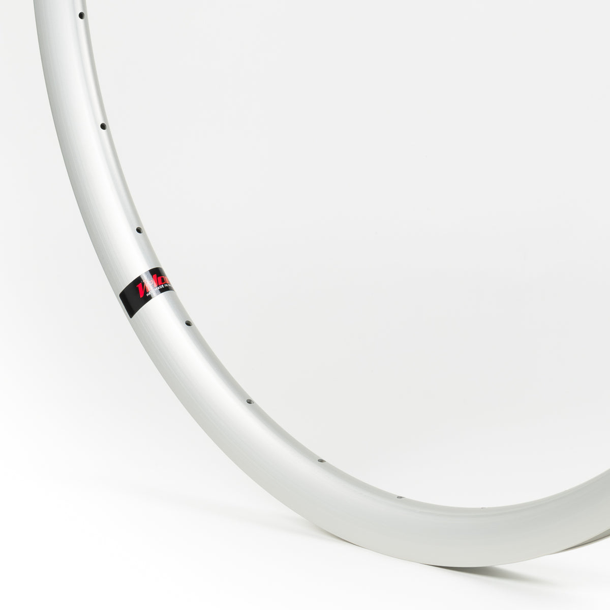 Velocity USA Aero Silver bicycle rim, close-up shot on a white background