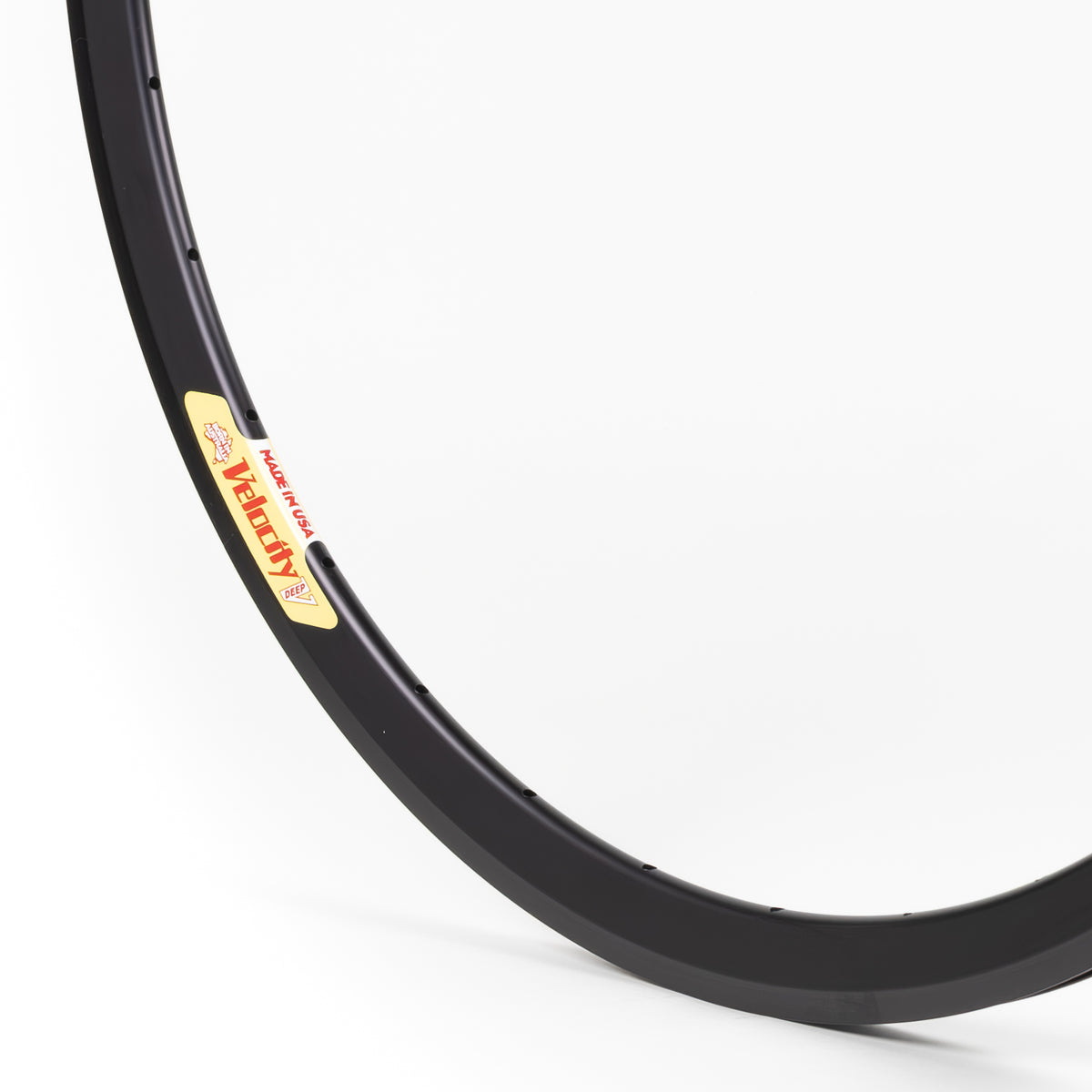 Velocity USA Deep V Black bicycle rim, close-up shot on a white background