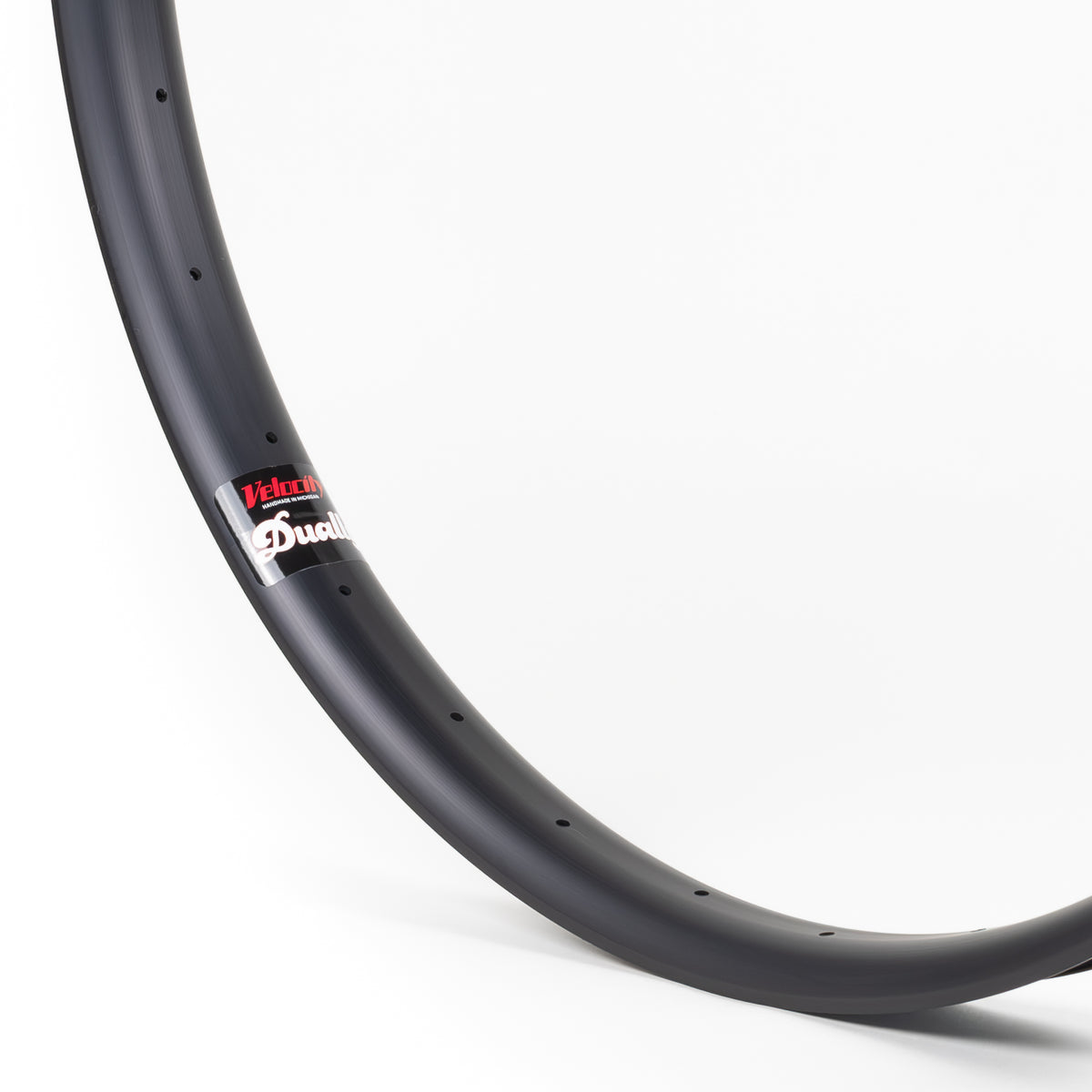 Velocity USA Dually Black bicycle rim, close-up shot on a white background