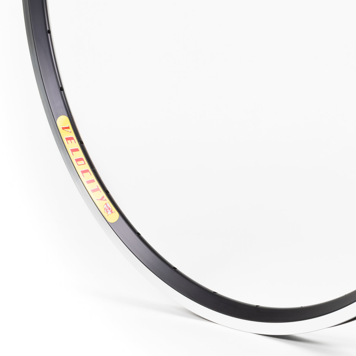 Velocity USA Dyad Black Machined Sidewall bicycle rim, close-up shot on a white background