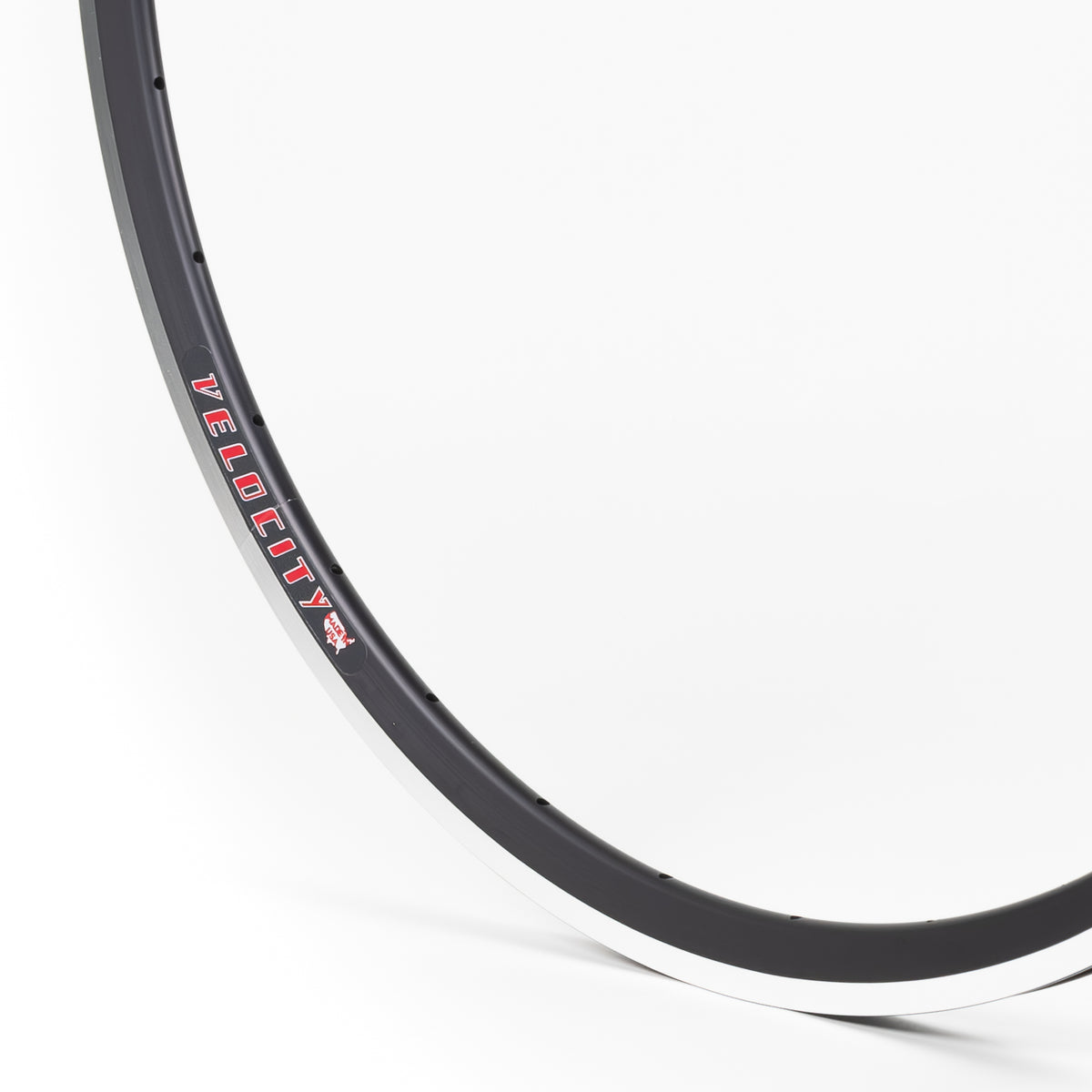 Velocity USA Fusion Black Machined Sidewall bicycle rim, close-up shot on a white background