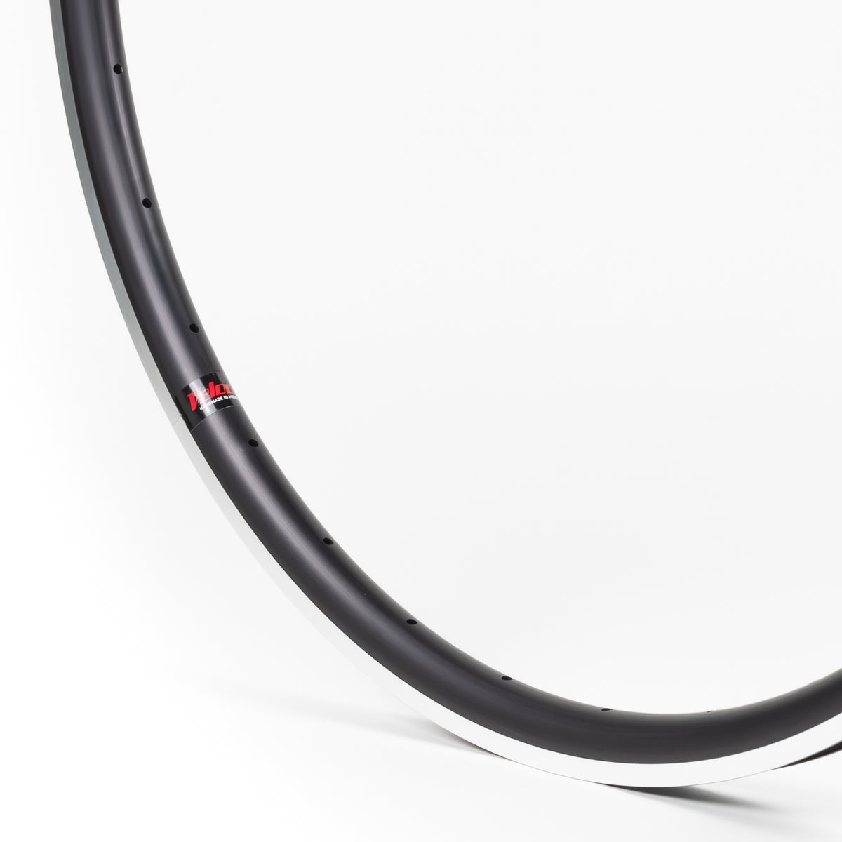 Velocity USA Quill Black Machined Sidewall bicycle rim, close-up shot on a white background