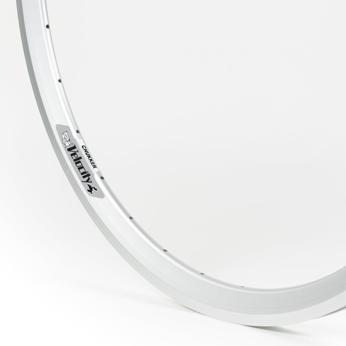 Velocity USA Chukker Silver bicycle rim, close-up shot on a white background