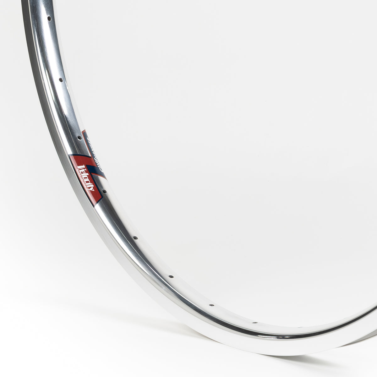 Velocity USA Cliffhanger Polished Machined Sidewall bicycle rim, close-up shot on a white background