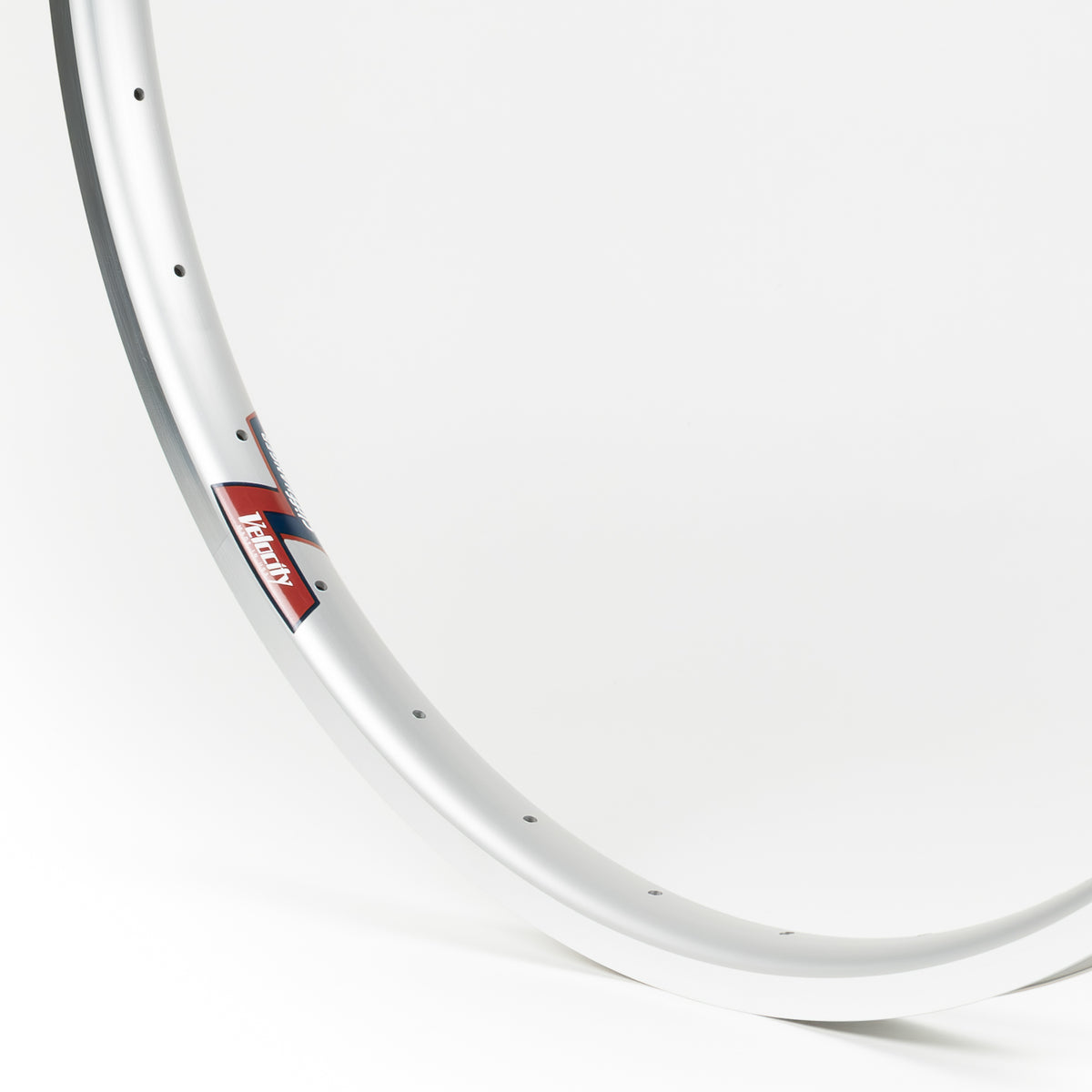 Velocity USA Cliffhanger Silver Machined Sidewall bicycle rim, close-up shot on a white background