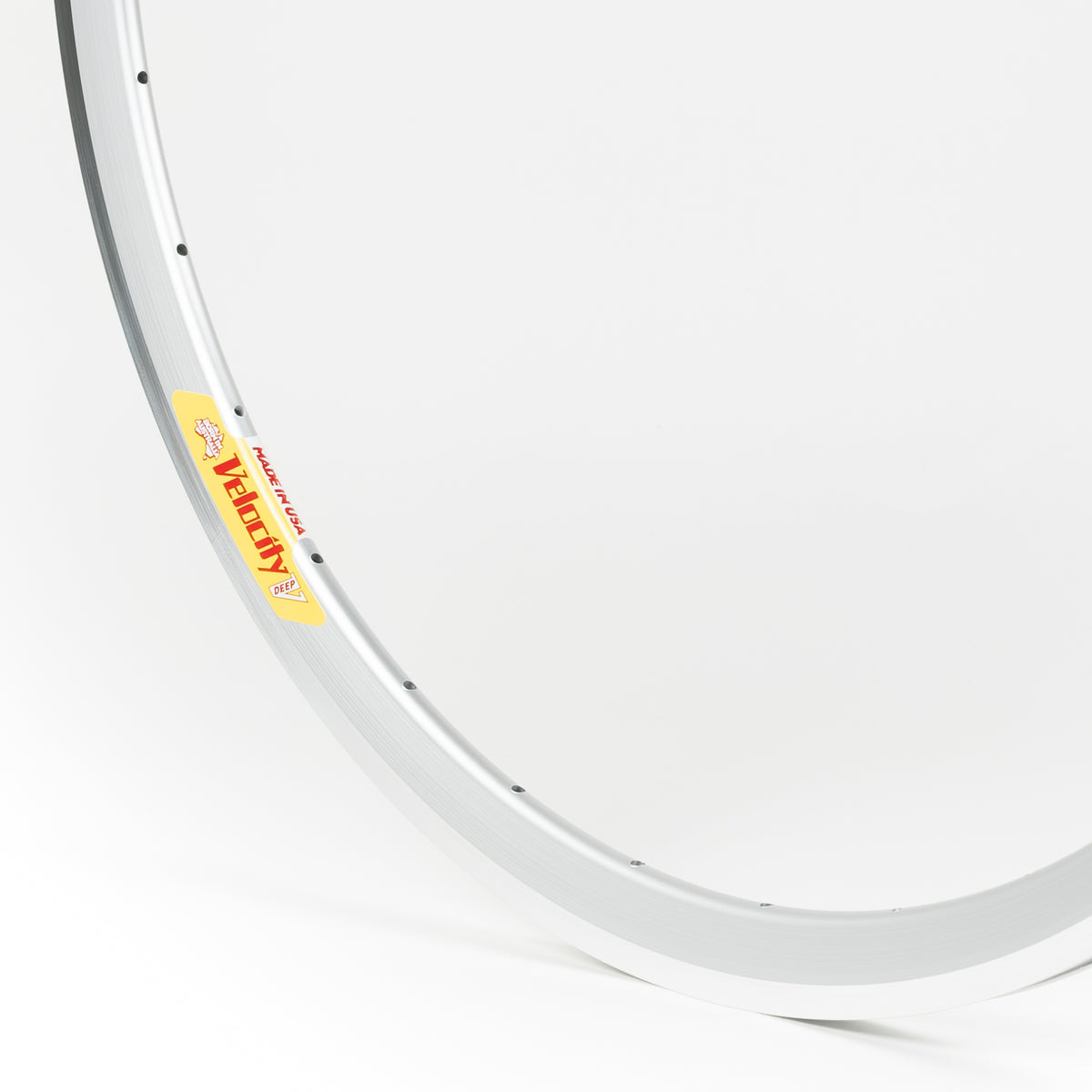 Velocity USA Deep V Silver Machined Sidewall bicycle rim, close-up shot on a white background