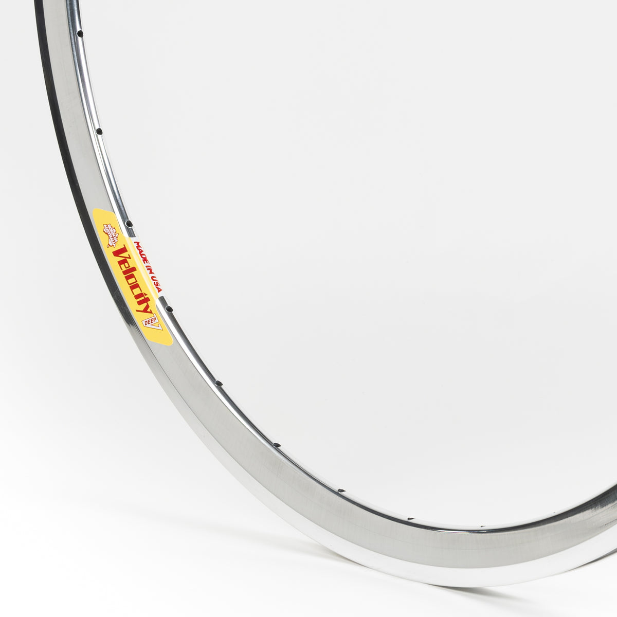 Velocity USA Deep V Polished bicycle rim, close-up shot on a white background