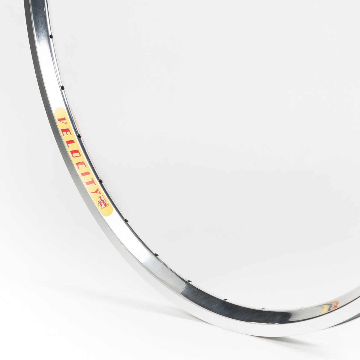 Velocity USA Dyad Polished Machined Sidewall bicycle rim, close-up shot on a white background