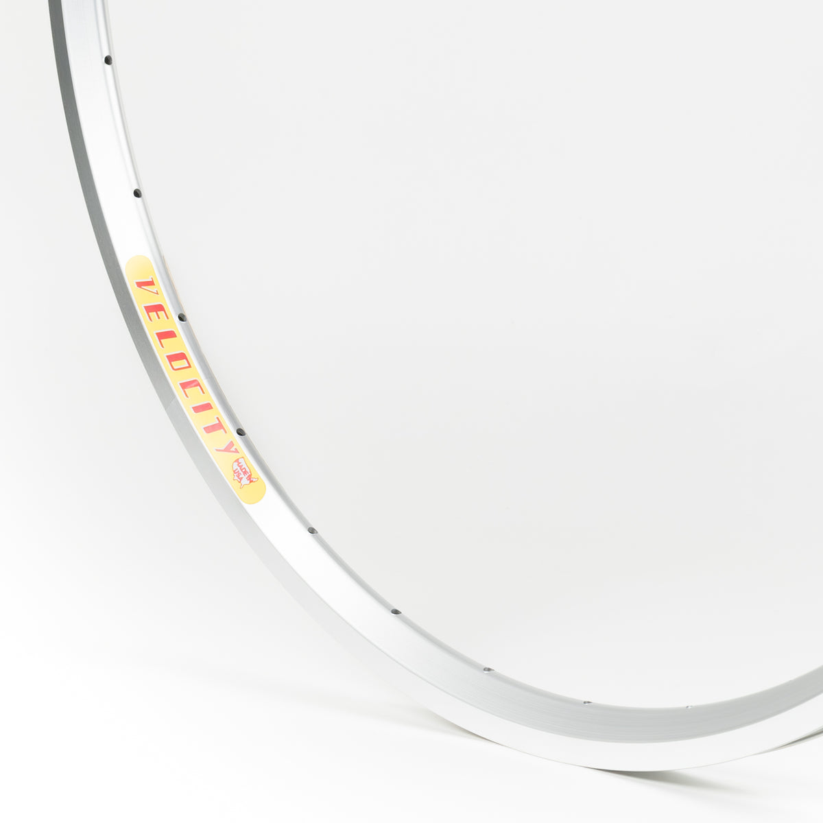Velocity USA Dyad Silver Machined Sidewall bicycle rim, close-up shot on a white background