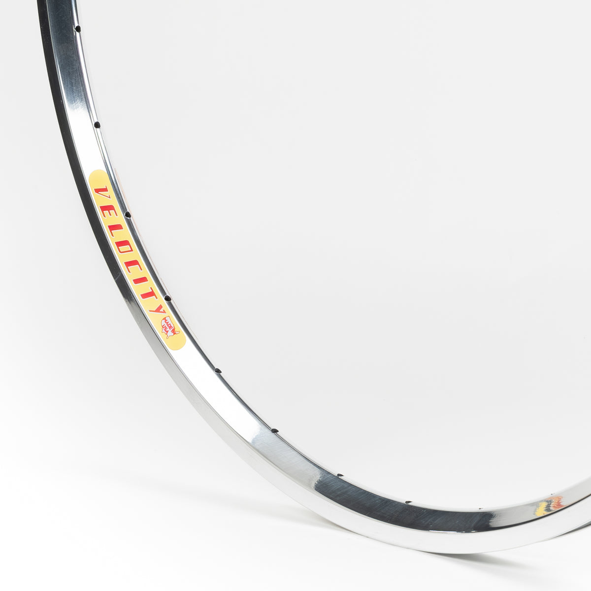 Velocity USA Dyad Polished bicycle rim, close-up shot on a white background