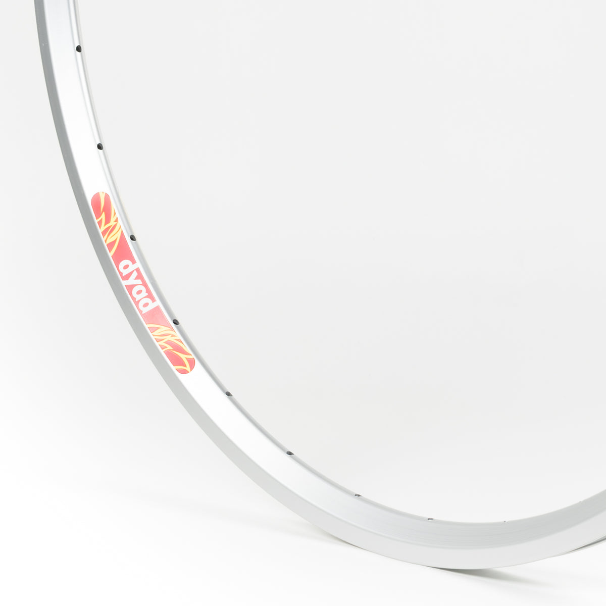 Velocity USA Dyad Silver bicycle rim, close-up shot on a white background
