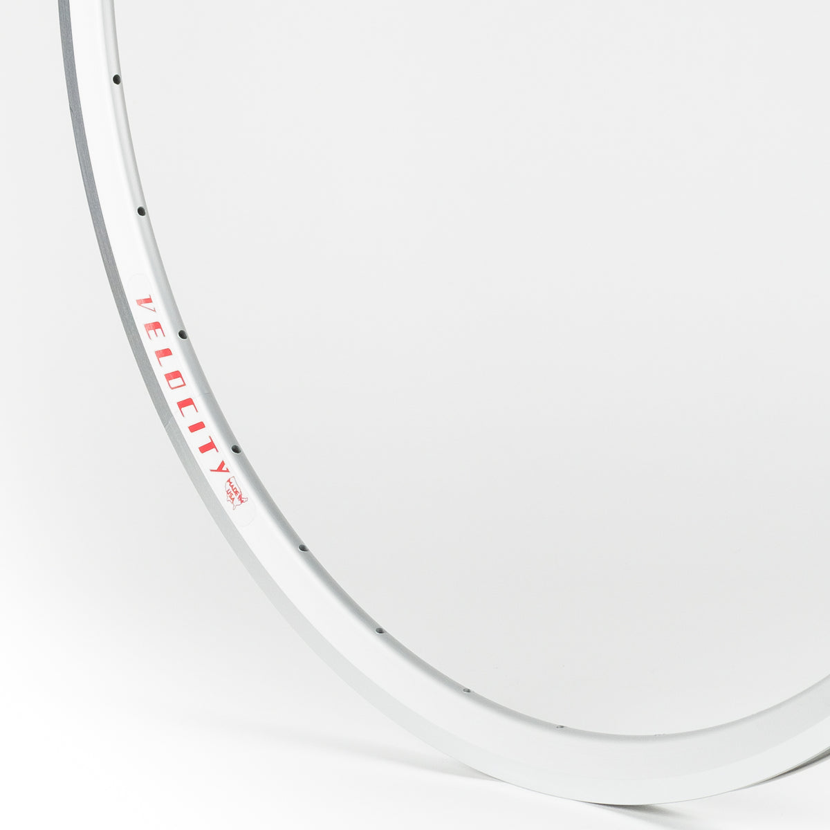 Velocity USA Fusion Silver Machined Sidewall bicycle rim, close-up shot on a white background
