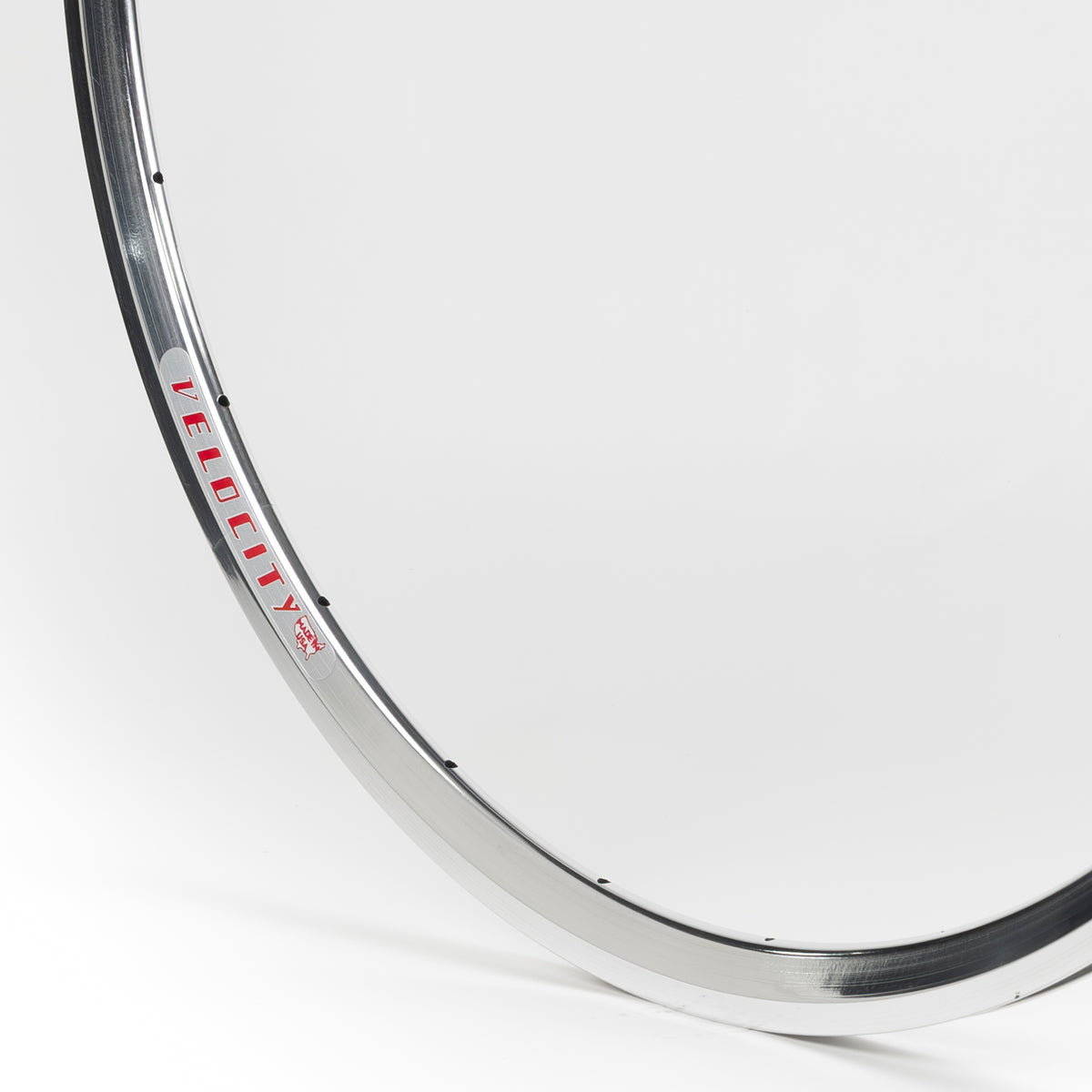 Velocity USA Fusion Polished bicycle rim, close-up shot on a white background